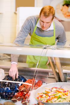 A fresh fish counter and a grocery store