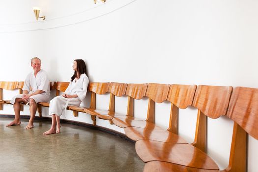 A man and woman in a retro style spa reception