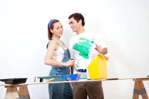 Happy Caucasian woman playing around with color on her boyfriend's shirt