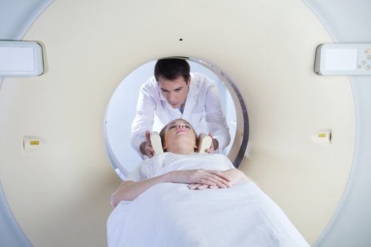 woman in a ct scan with medical professional