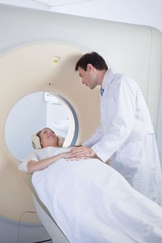 Doctor comforting patient before CT scan