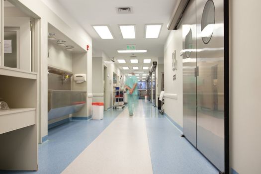 Blurred motion of doctor walking in a hospital corridor