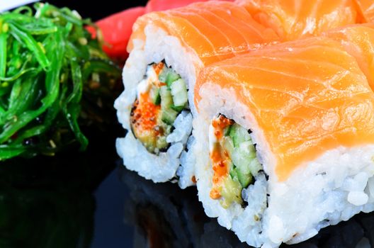 Japanese food roll made of salmon close up