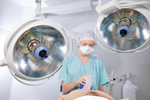 Anesthetist watching over patient before surgery