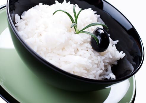 A bowl of cooked Rice with rosemary close up