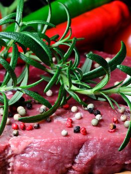 Beef steak on wooden board close up