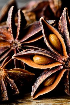 Few star anise on dark wooden table