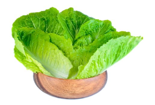 Roman lettuce leaves in wooden bowl