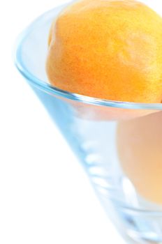 Glass bowl with apricots close up