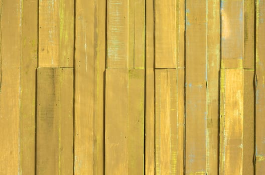 Texture of Yellow color paint plank wall for background