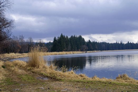 Lake in the early spring with a dramatic sky