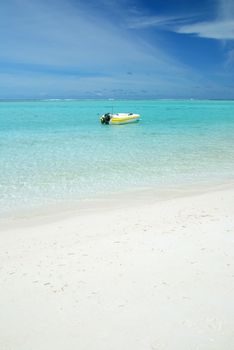 Small boat near the beautiful exotic beach