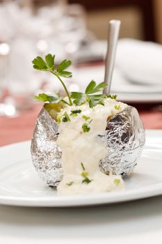 Baked potato with sour cream sauce