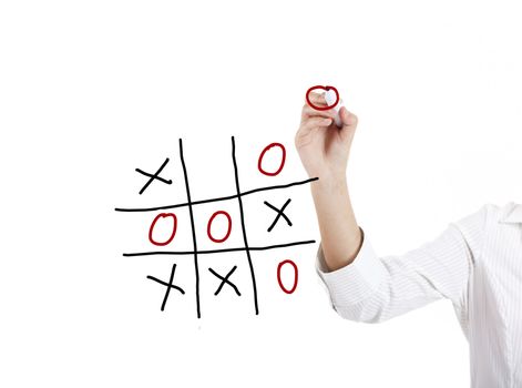 Young businesswoman playing the game noughts and crosses