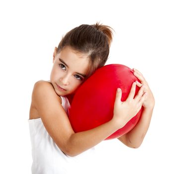 Portrait of a little girl embracing a red balloon, isolated on white background