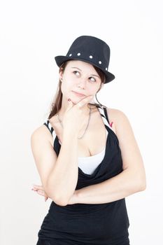 young brunette girl with black hat wearing is thinking about somethink