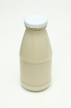 Image of milk in glass bottle with close cover.