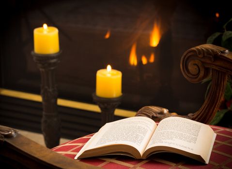 James Joyce 1917 book open on chair in chilly scene with fire and candles in background