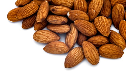 Heap of almonds isolated on white background