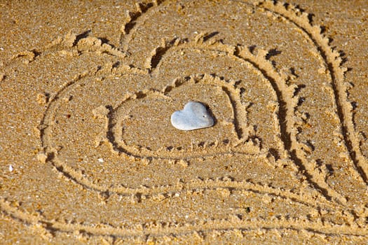 Hearts drawn out on a sandy beach