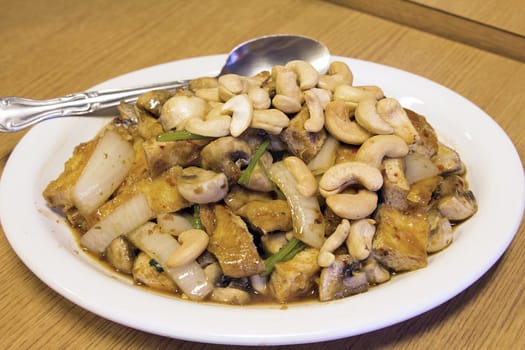 Thai Stir Fry Tofu with Cashew Nuts Onions Mushroom and Cilantro Dish