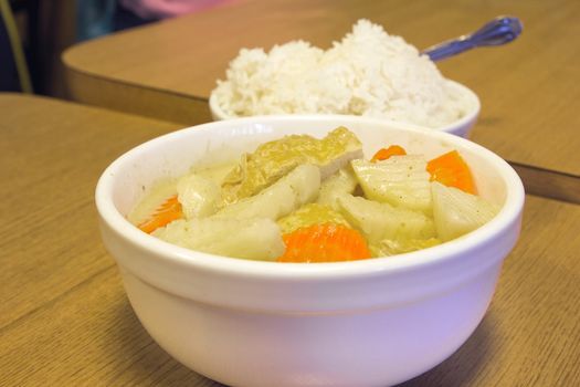 Thai Yellow Curry with Tofu Potatoes Carrots with Bowl of Rice