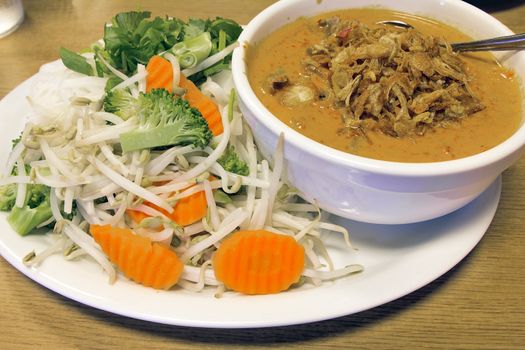 Thai Beef Curry Noodles with Raw Vegetables Broccoli Carrots Bean Sprouts and Gravy