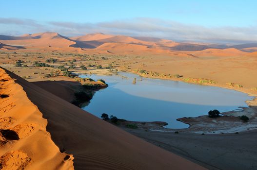 A rare sight: Sossusvlei in the Namib desert of Namibia filled with water. Some of the highest dunes in the world are in the background.