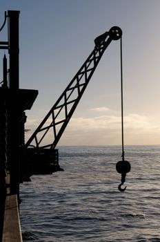 Hoisting crane silhouette at the jetty in Swakopmund Namibia