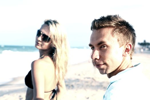 girl and boy on ocean beach