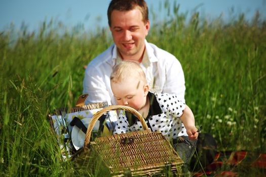  happy family on picnic in green grass