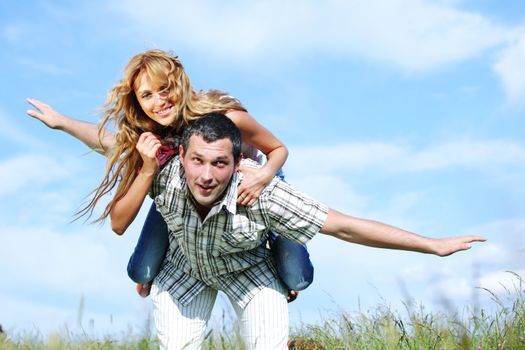 man and woman hug in the sky