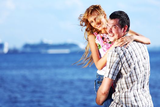 man and woman hug in the sky and sea on sea