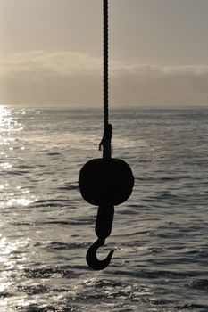 Hoisting crane silhouette at the jetty in Swakopmund, Namibia