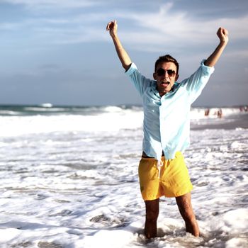 young man on vacation happiness in water