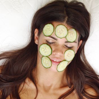cucumbers circles on a girl face