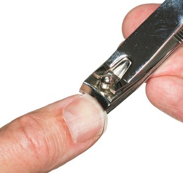 Macro photo of a set of nail clippers cutting thumbnail on senior caucasian thumb