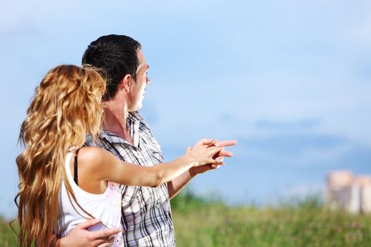 man and woman see houses and new flat