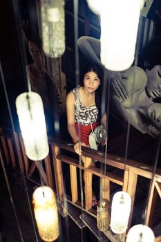 Portrait woman at stair with lamp light