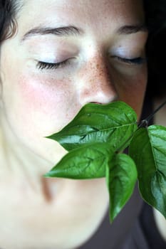 young woman with green foliage