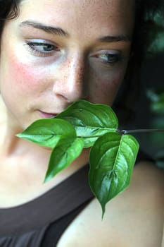 young woman with green foliage