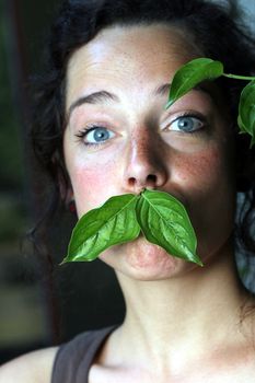 young woman with funny green foliage beard