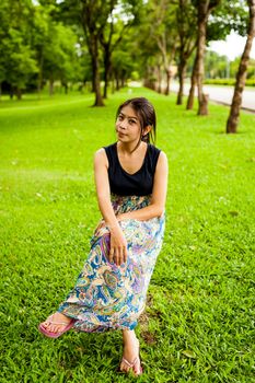 Portrait woman asian girl with tree background  in the garden