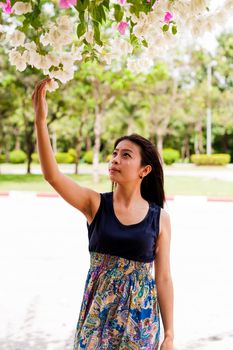 Portrait woman asian girl with tree background  in the garden