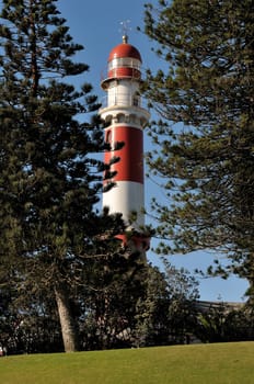 The historical lighthouse in Swakopmund, Namibia. Commissioned in 1903 and originally 11 metres high, the height extended in 1910 to the present height of 111 ft, 34 meters. This lighthouse has a focal plane of 35 m (115 ft) with a 28 m (111 ft) round tower with lantern and double gallery.