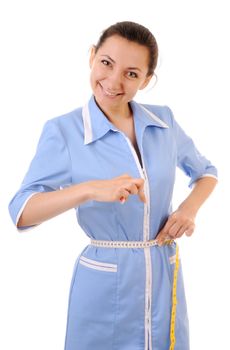 Young woman in blue uniform shows how her waist is thin. Isolated on white background.