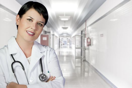 brunette female doctor on duty at white hospital corridor