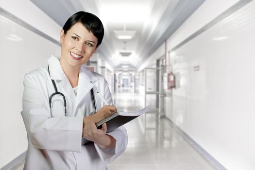 brunette female doctor on duty at white hospital corridor, PHD and career women