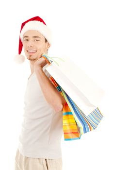 Young men in christmas red hat with paper presents bags isolated on white background