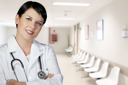 brunette female doctor on duty at the ER hospital lobby, PHD, career woman